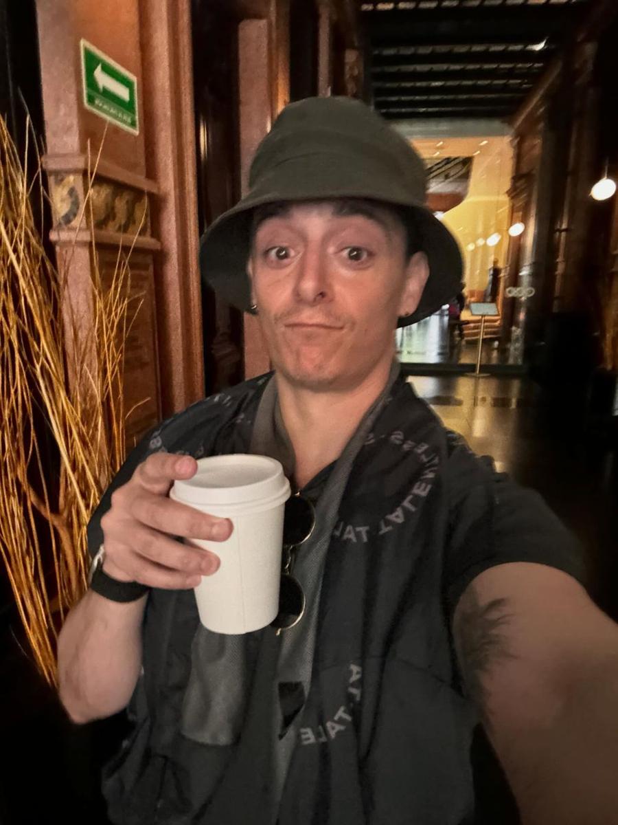 Eli Samuel on set with a coffee