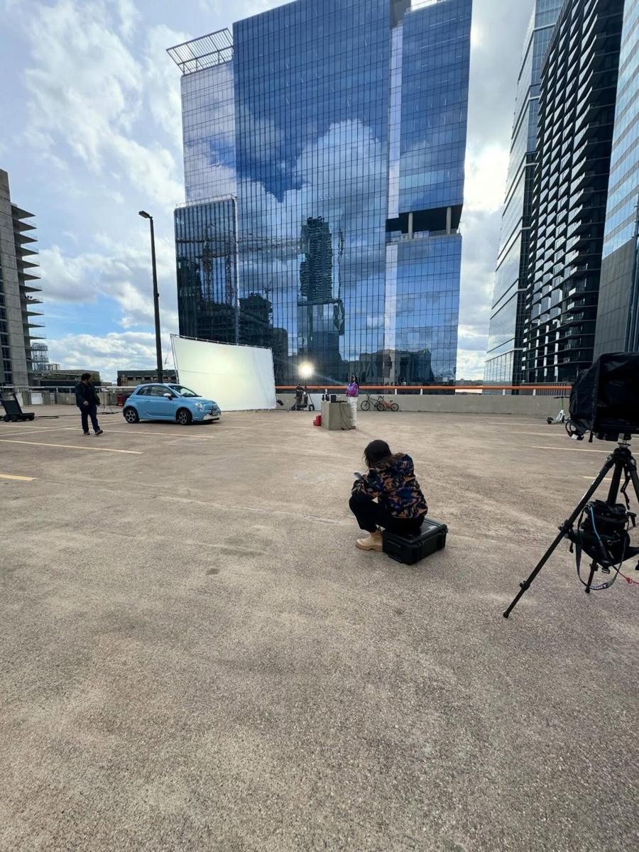 Tripod tech station in a parking lot downtown