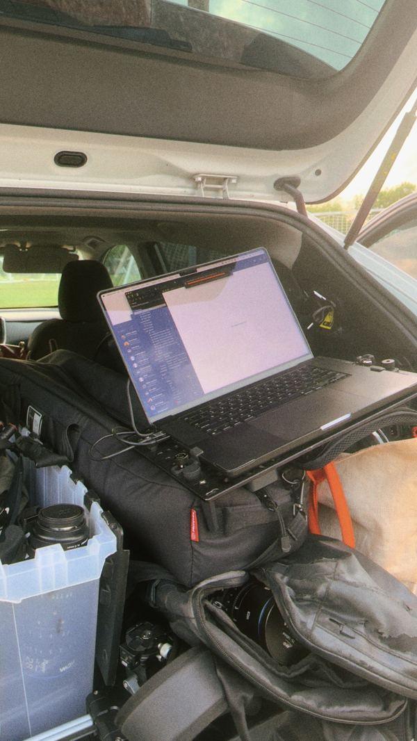 Laptop running in the back of a car